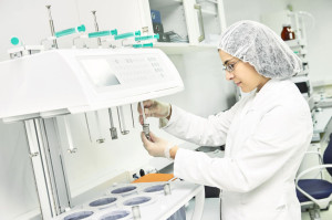 Pharmaceutical researcher making dissolution test